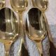 5 gilt metal mocha spoons by Christofle silversmiths, Cluny pattern, 10cm