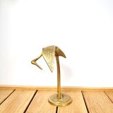 Brass heron head down