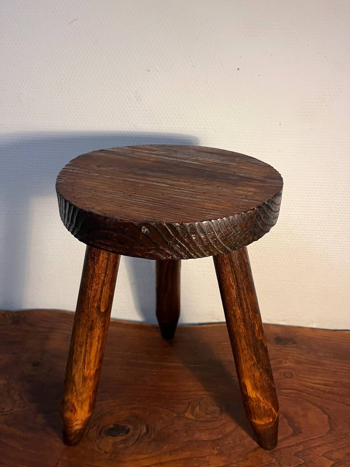 Round wooden tripod stool