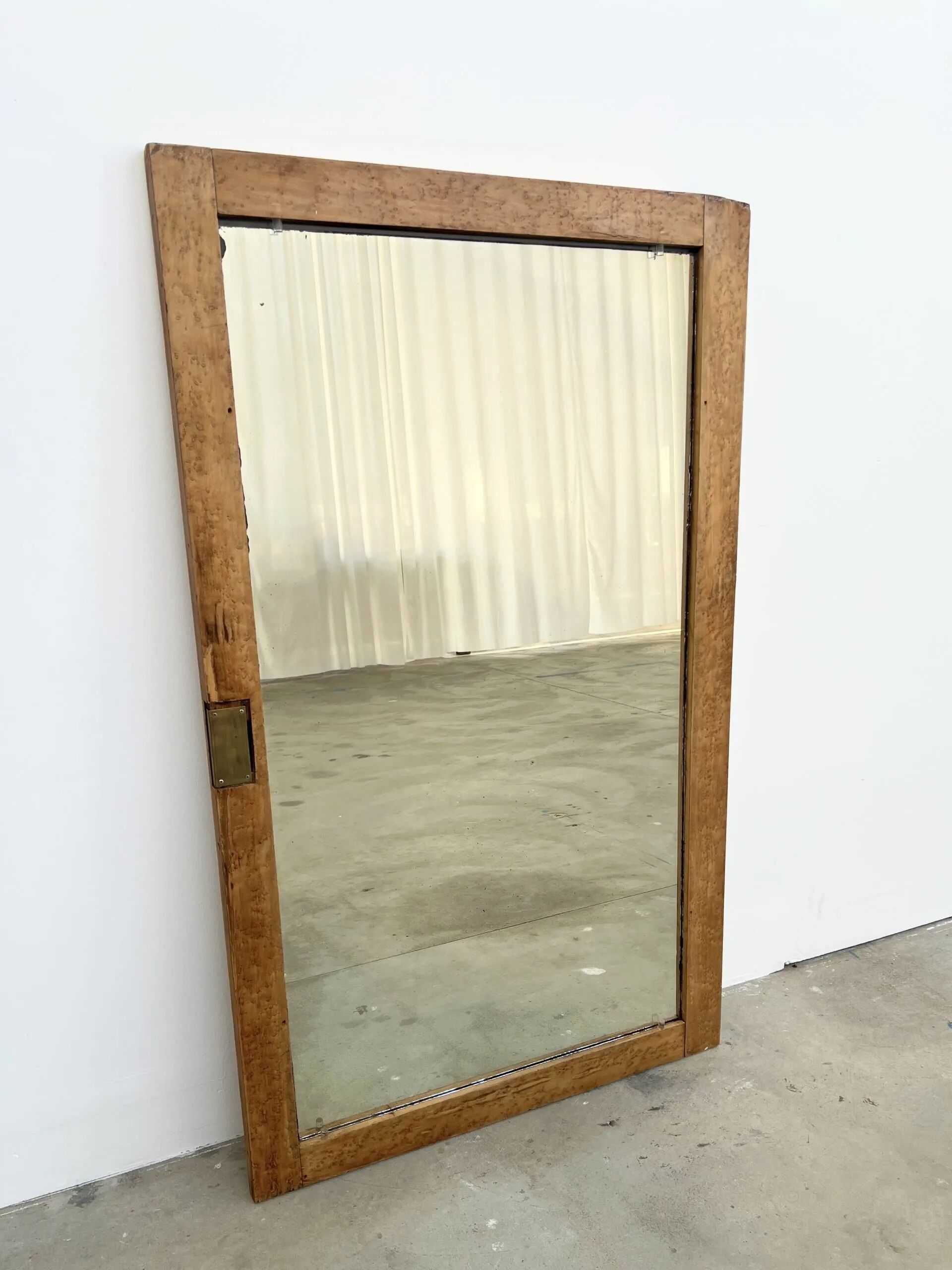 Antique mirror on an elm wardrobe door