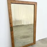 Antique mirror on an elm wardrobe door