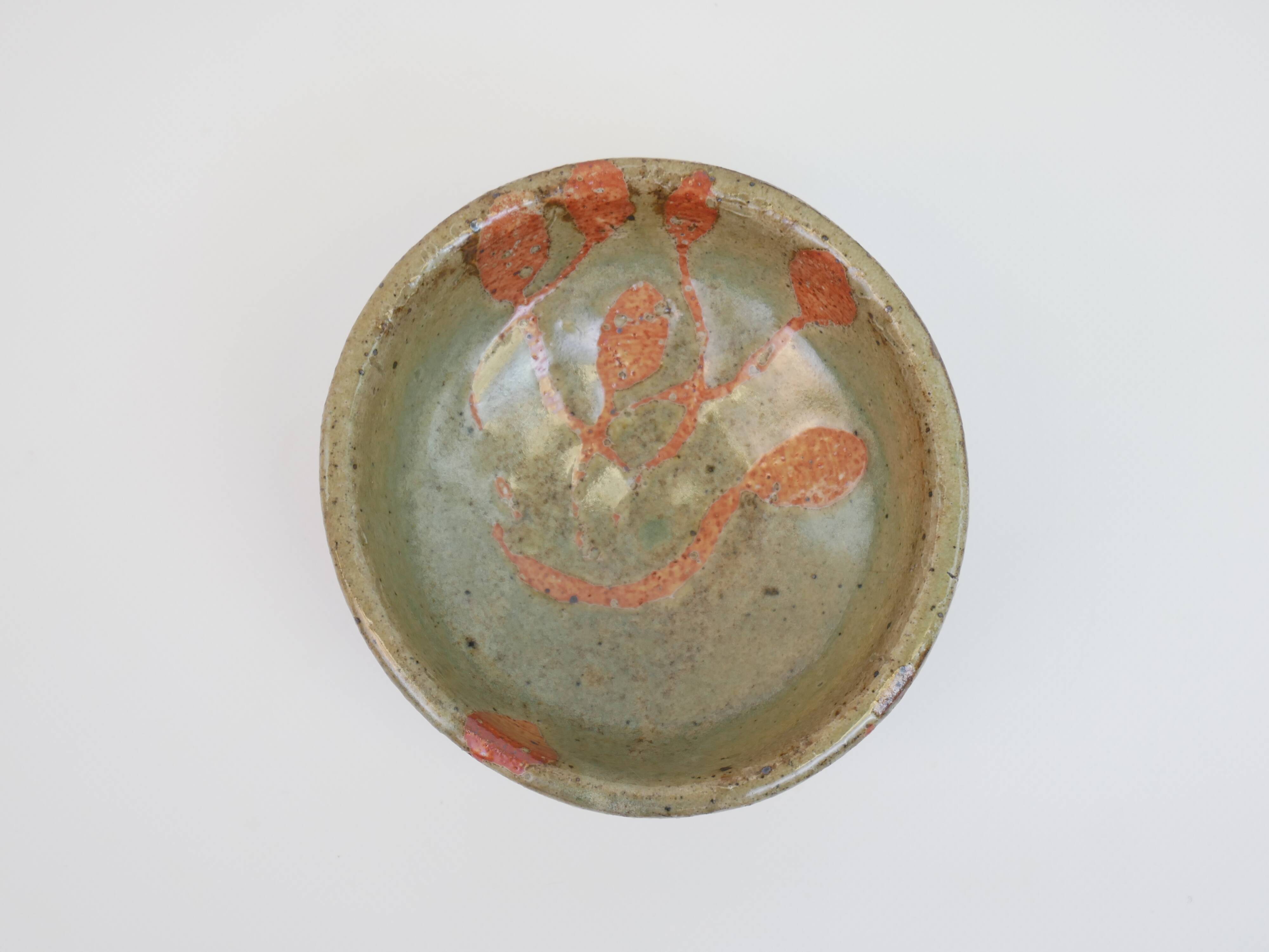 Small bowl in water green glazed ceramic with coral pink pattern