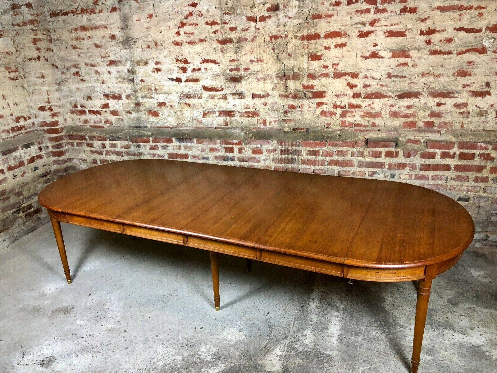 Oval walnut table with 6 legs from 1m12 to 2.94 (4 extensions of 45.5 cm)