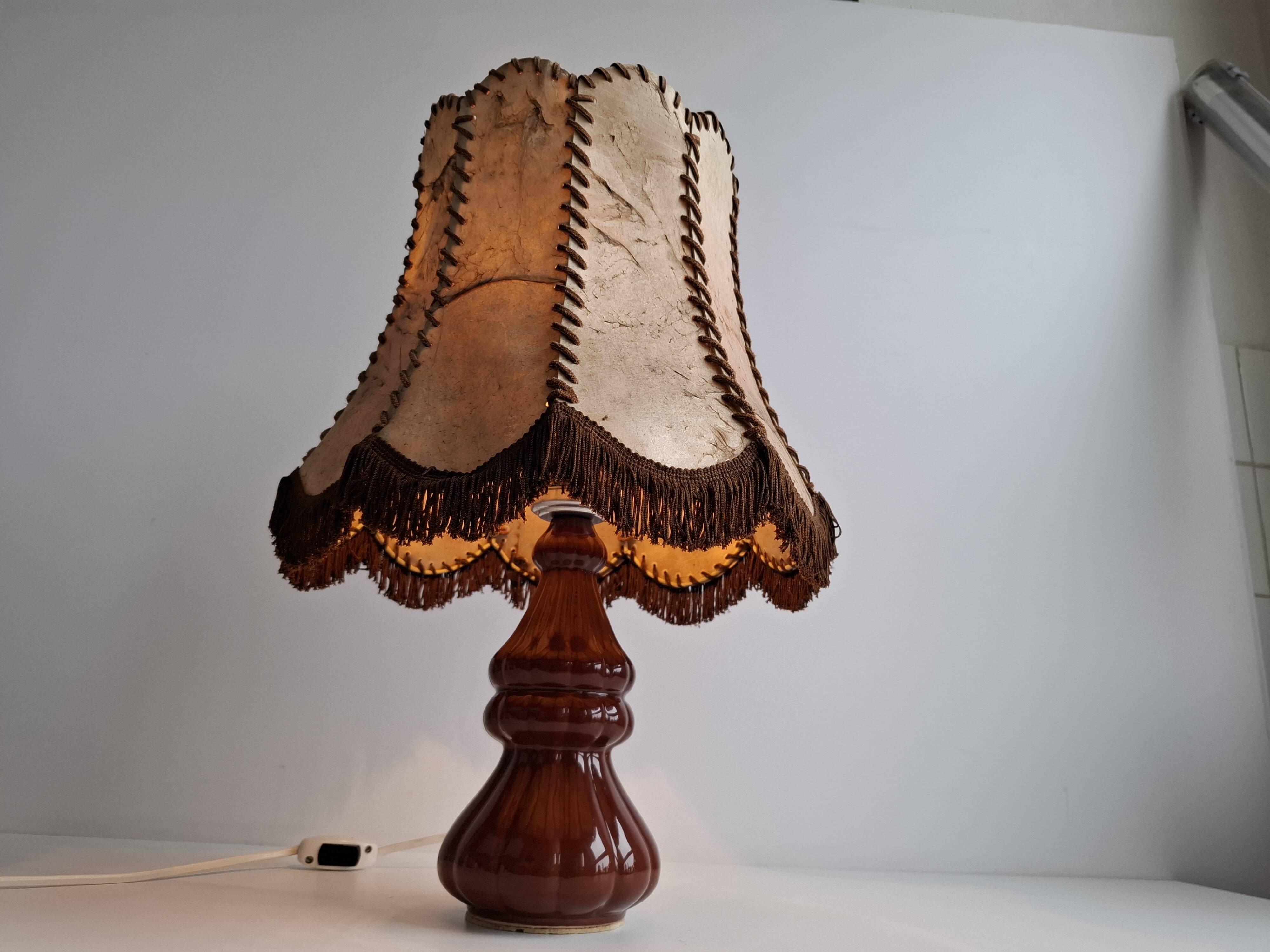 Vintage ceramic table lamp with hand-stitched leather shade, 1980s.