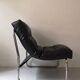 Tubular fireside chair in black skai and metal, design 1970