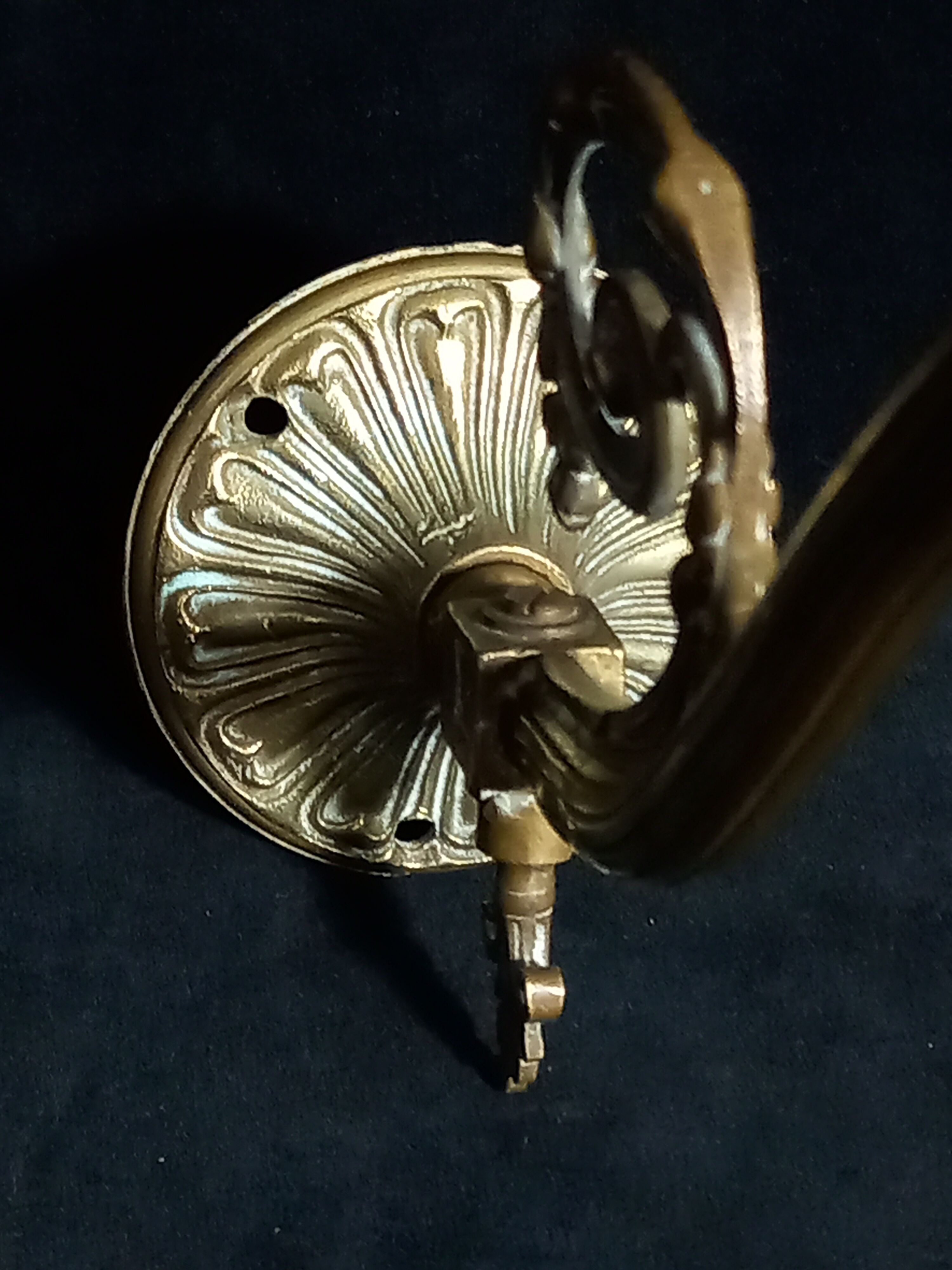 Brass wall lamp with speckled glass tulip