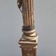 Large antique church candlestick in carved wood transformed into a lamp.