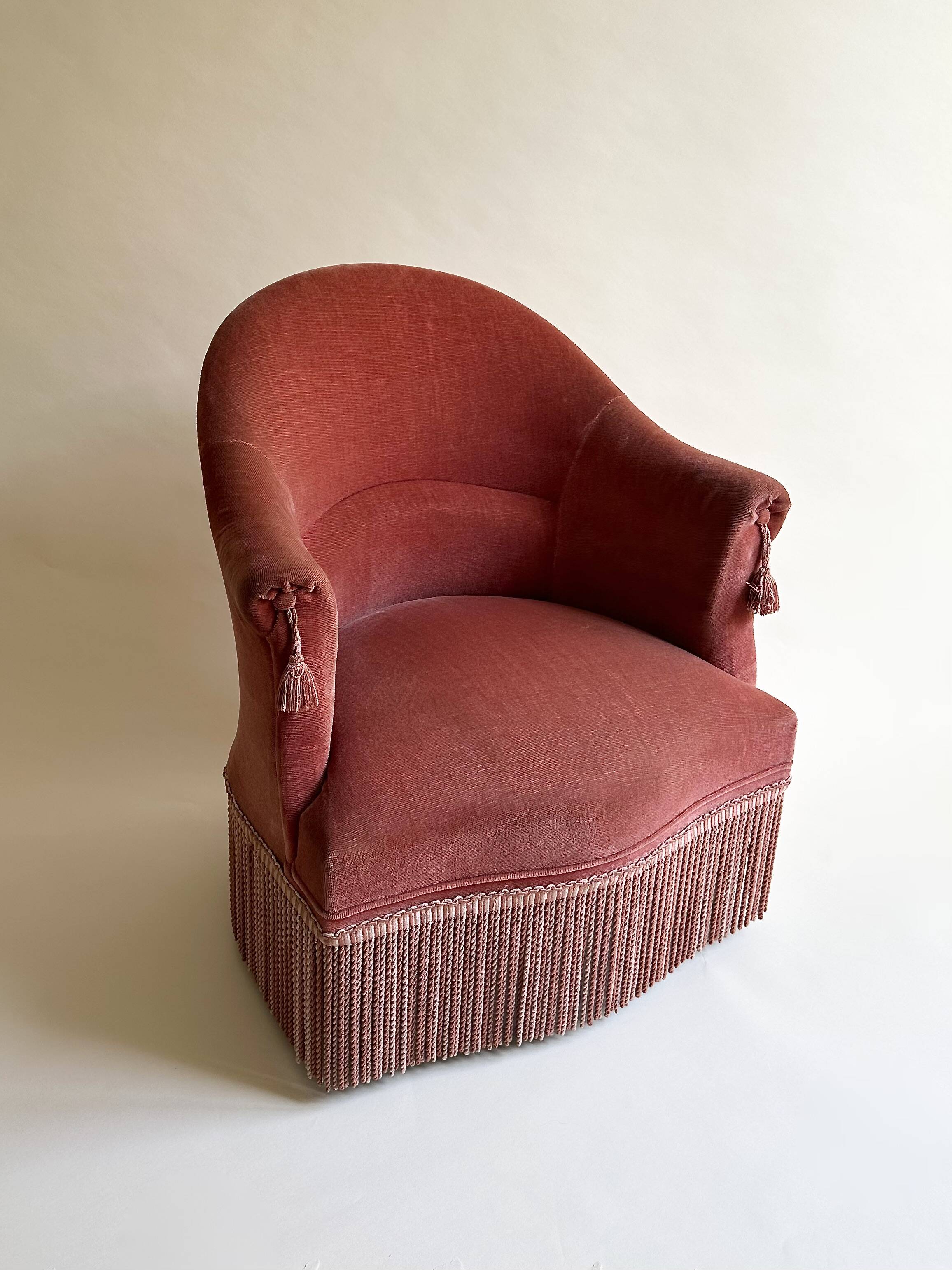 Pink-orange velvet tub chair