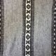 Handwoven vintage geometrical rug, grey background