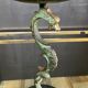 Empire style bronze candlestick with a candle holder