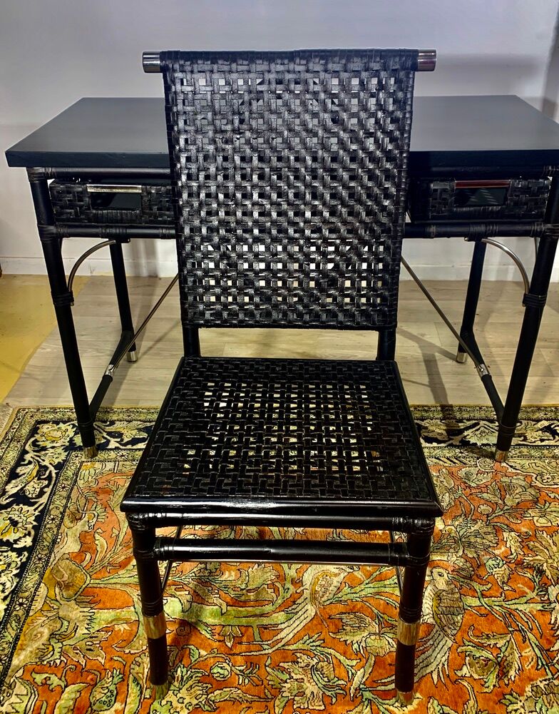 Office with its rattan armchair and brown leather braiding, italian design