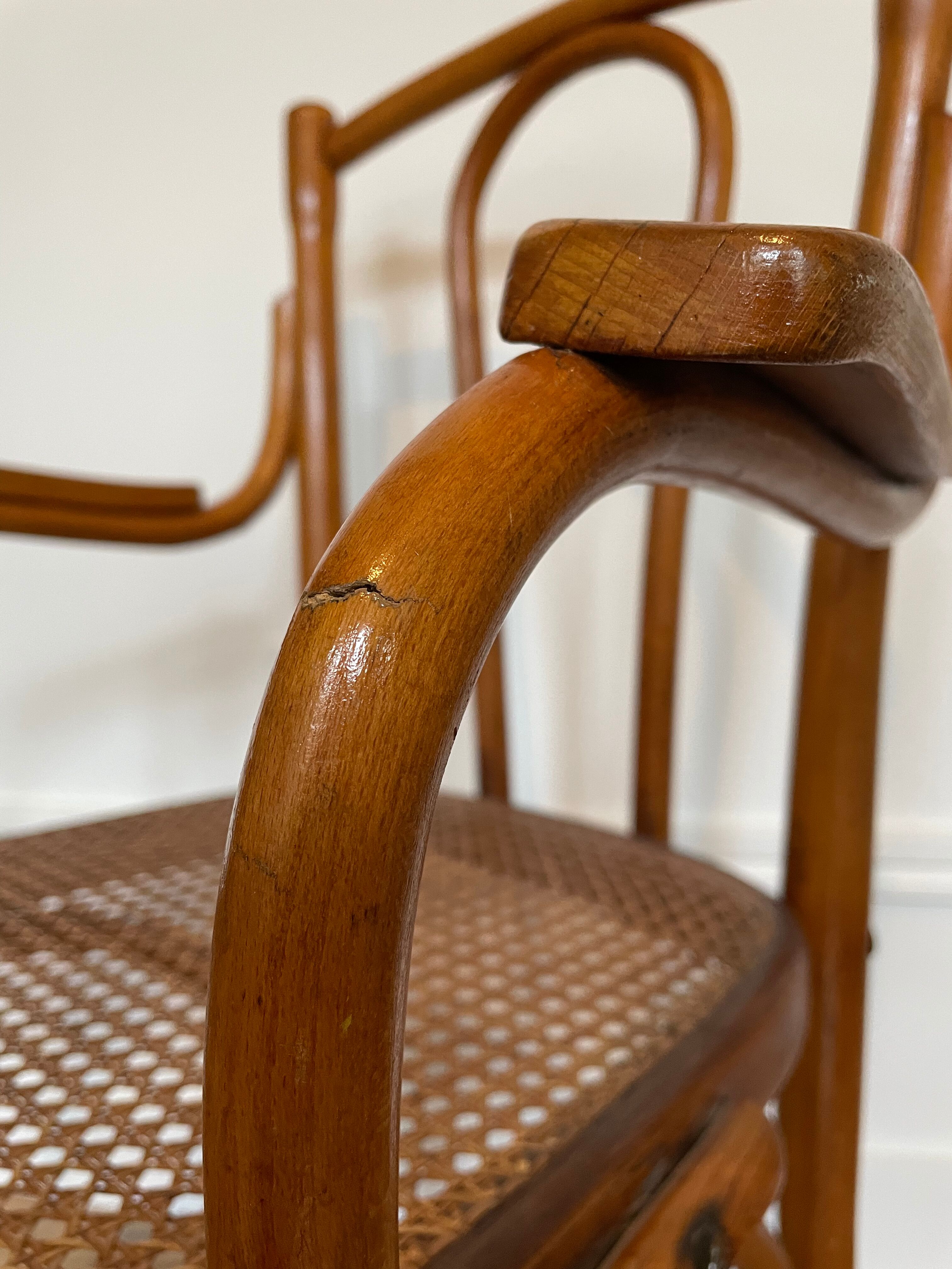 Old thonet armchair in curved wood and rattan cane