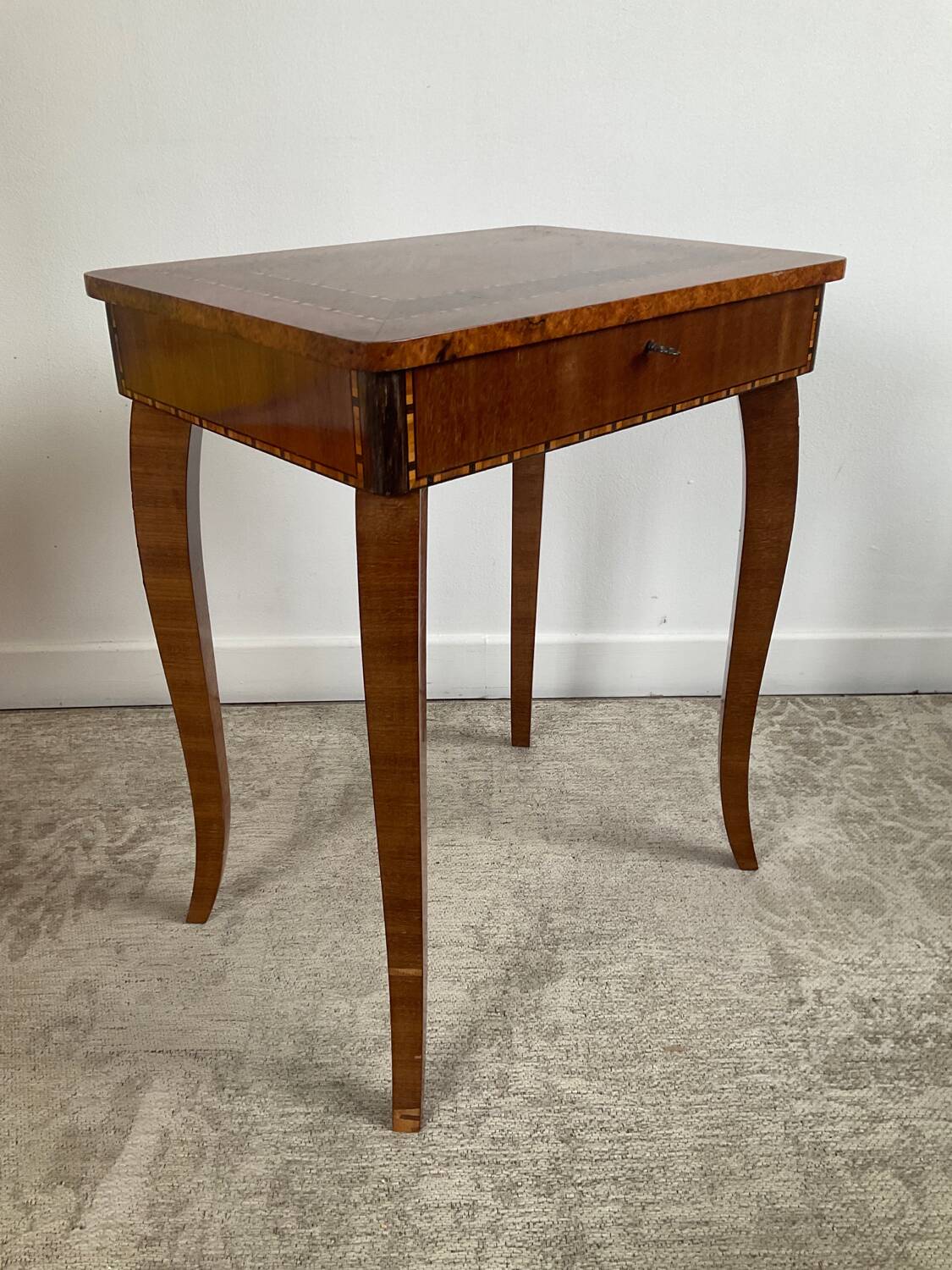 Small marquetry pedestal table with key storage