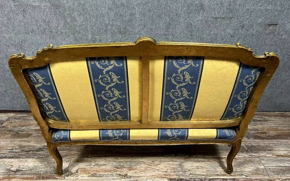 Louis XV style bench in gilded wood, 20th century