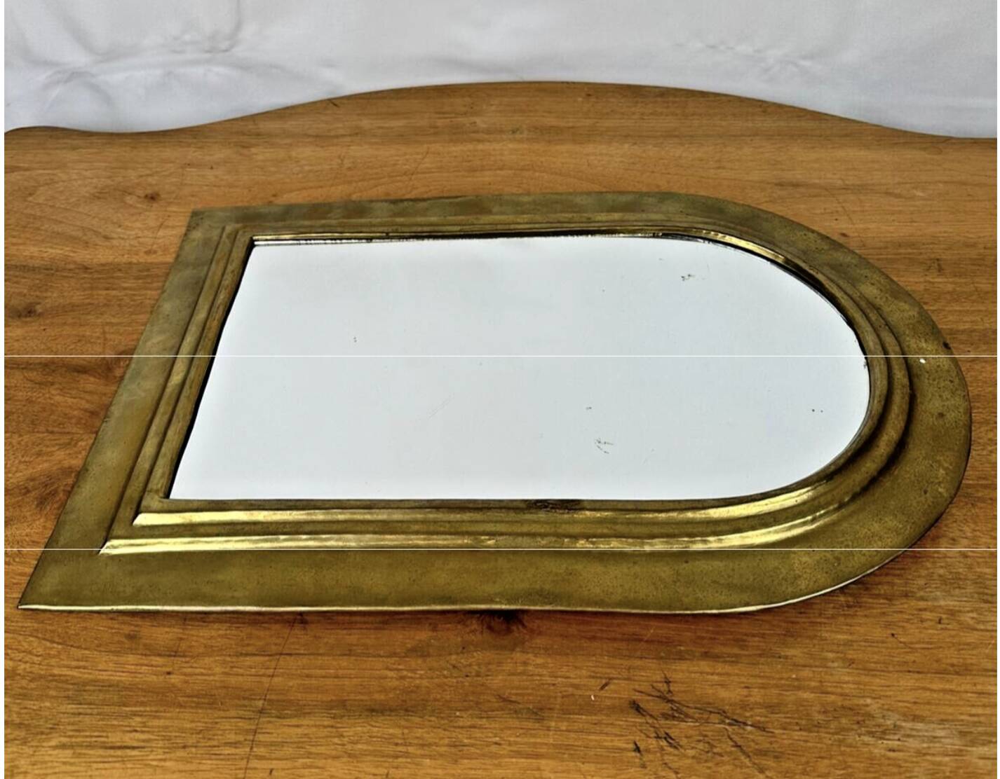 Vintage golden half-moon mirror