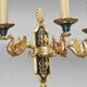 Pair of gold bronze wall lights in Empire style with three lights "Lucien Gau"