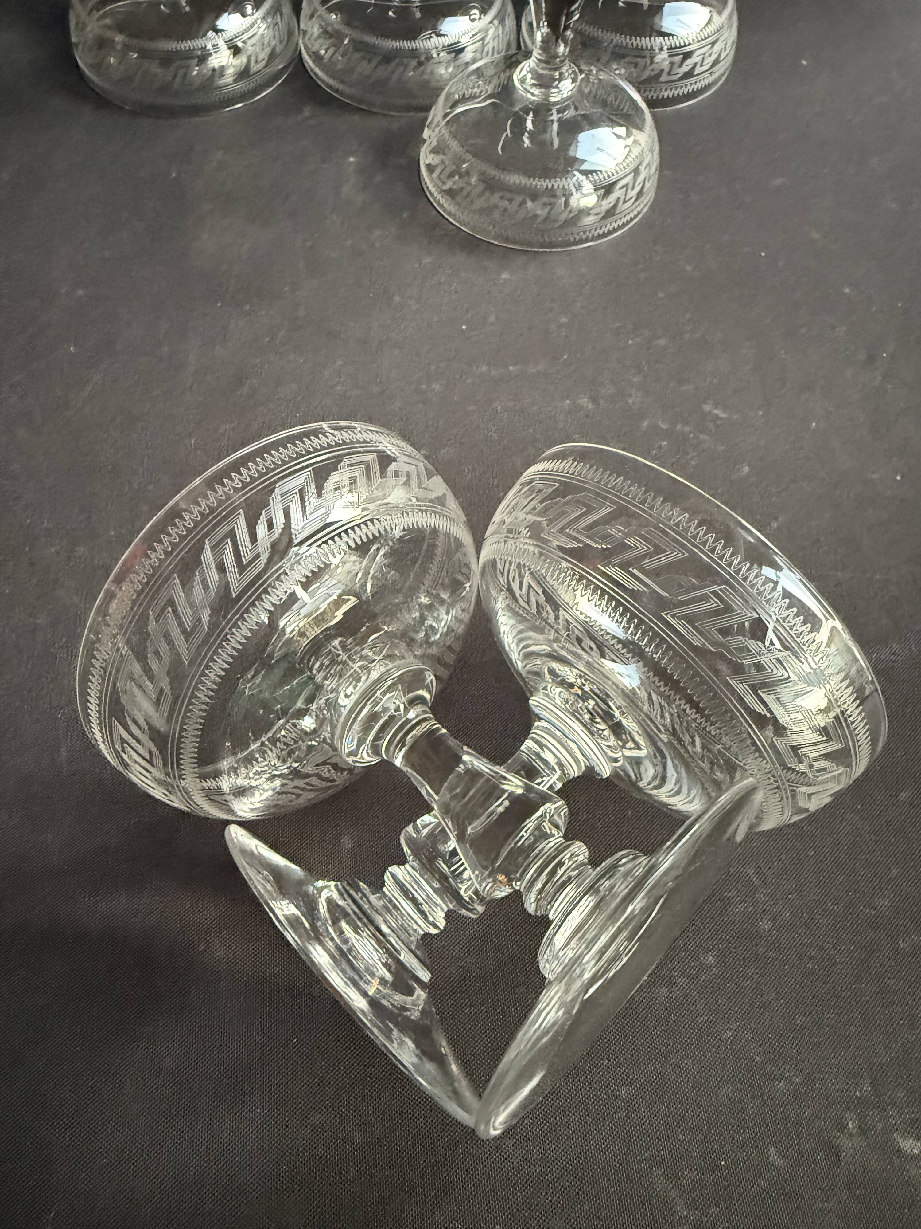 6 Baccarat champagne coupes with Greek engraving, slanted.