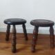 2 round tripod stools