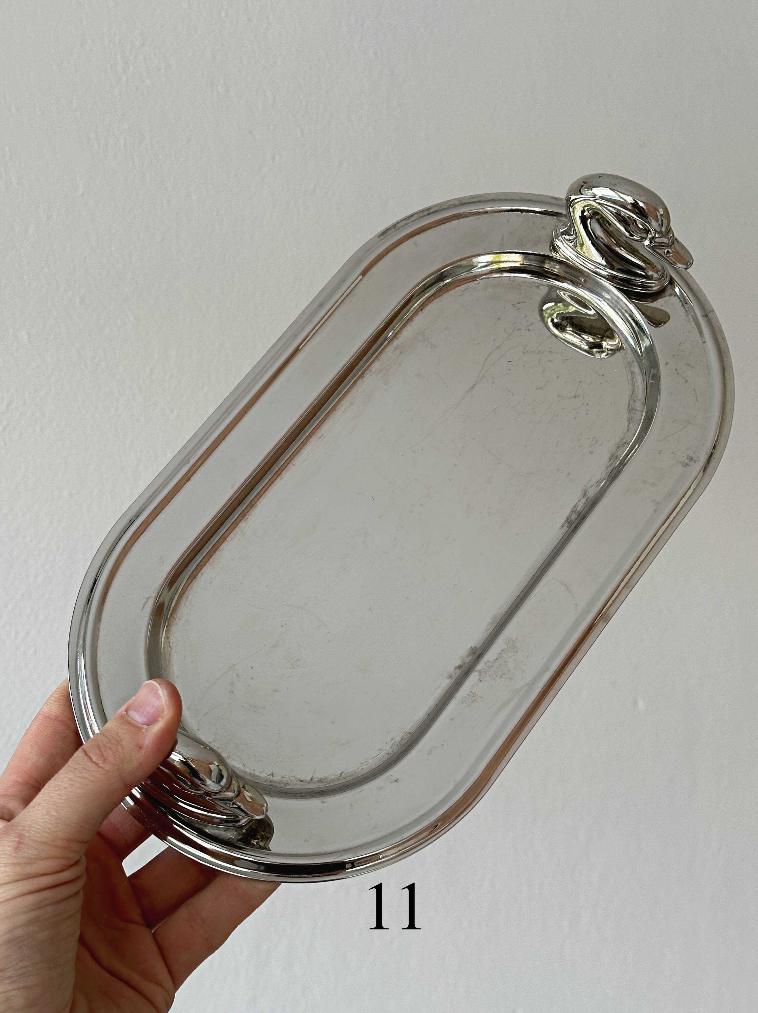 Metal dish with goose head handles serving tray