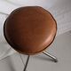 Vintage rotating stool seated in leather and chrome legs