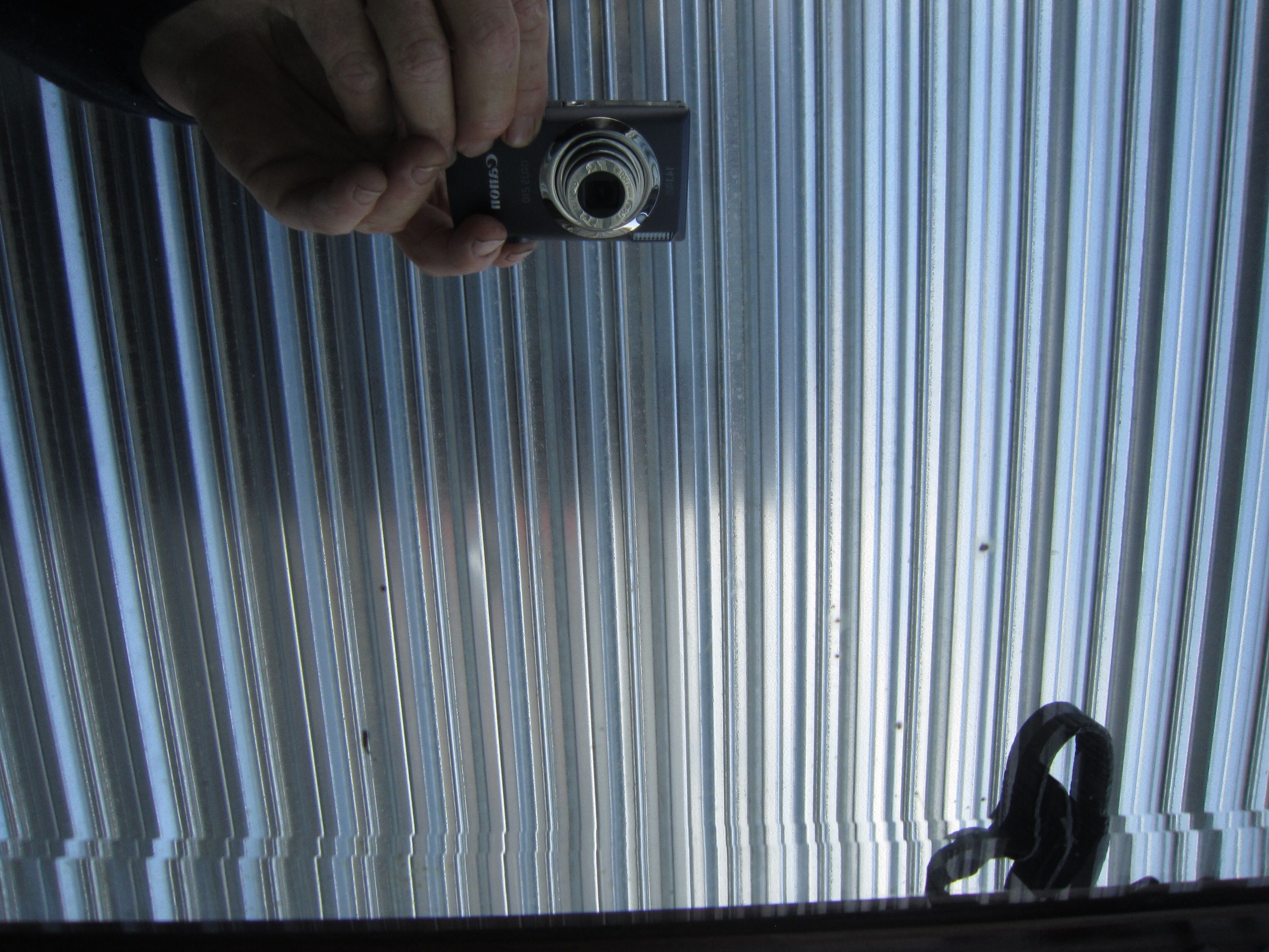 Vestiaire wears hat coat and art deco umbrella in wrought iron patere wood