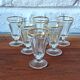 Antique footed liqueur glasses with gold trim from the early 20th century.