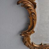 Miroir en stuc doré rocaille époque XIXème 110cm