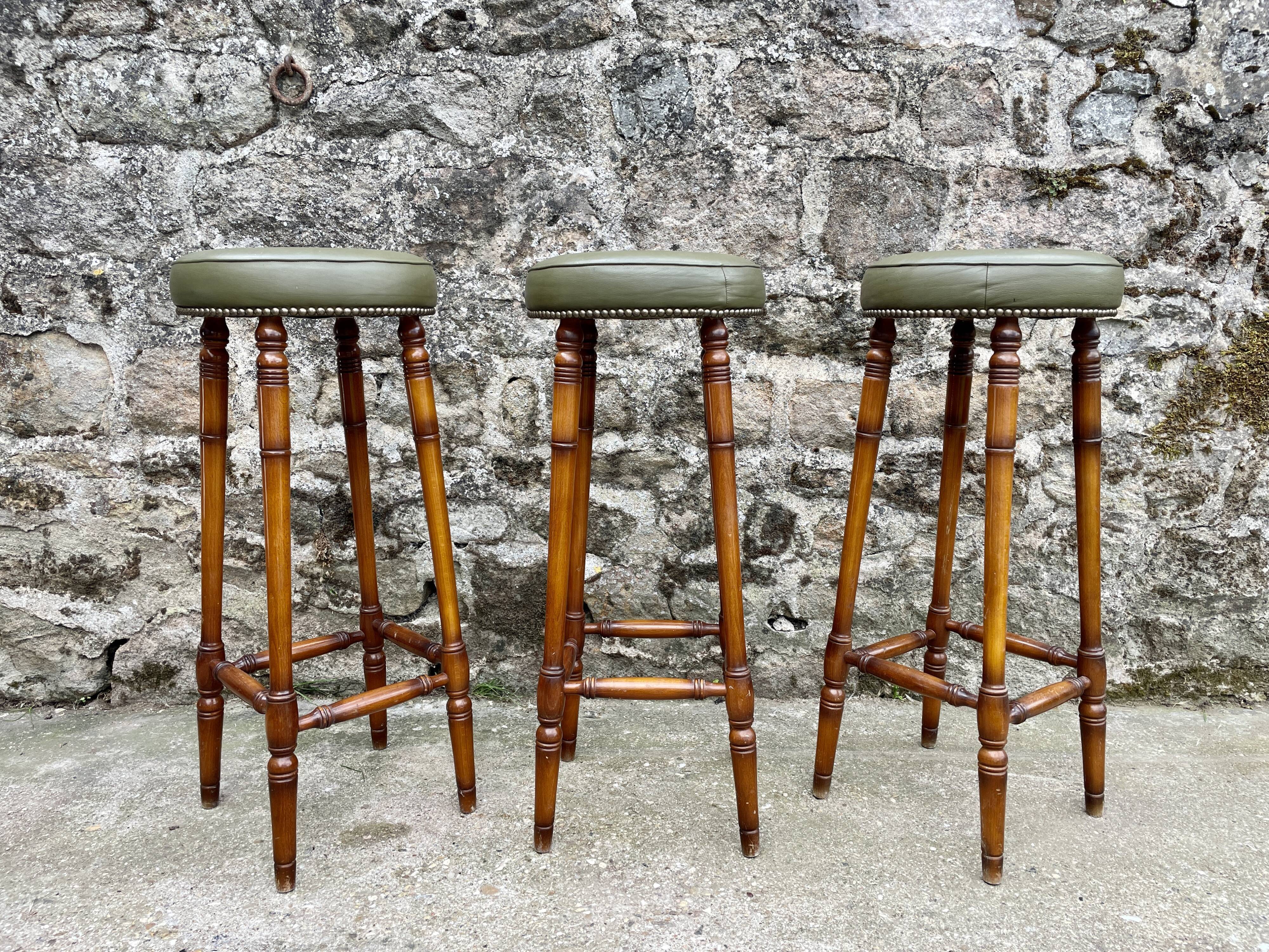 Trio of leather bar stools