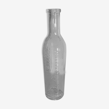 Vintage transparent moulded glass graduated bottle