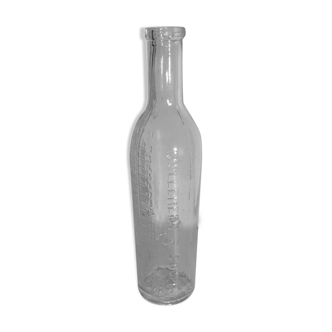 Vintage transparent moulded glass graduated bottle