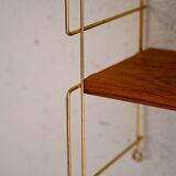 Wall-mounted shelf (Hylla) with brass structure