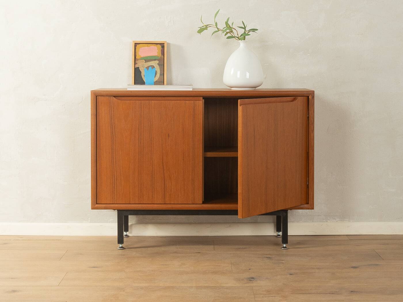 Classic chest of drawers from the 1960s with practical, closed storage space