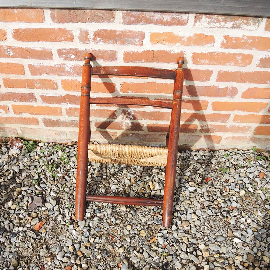 Old straw armchair for children