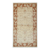 Tapis oriental en laine beige à motif floral