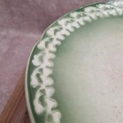 Antique compote stand Lunéville St Clément with green clover decoration.