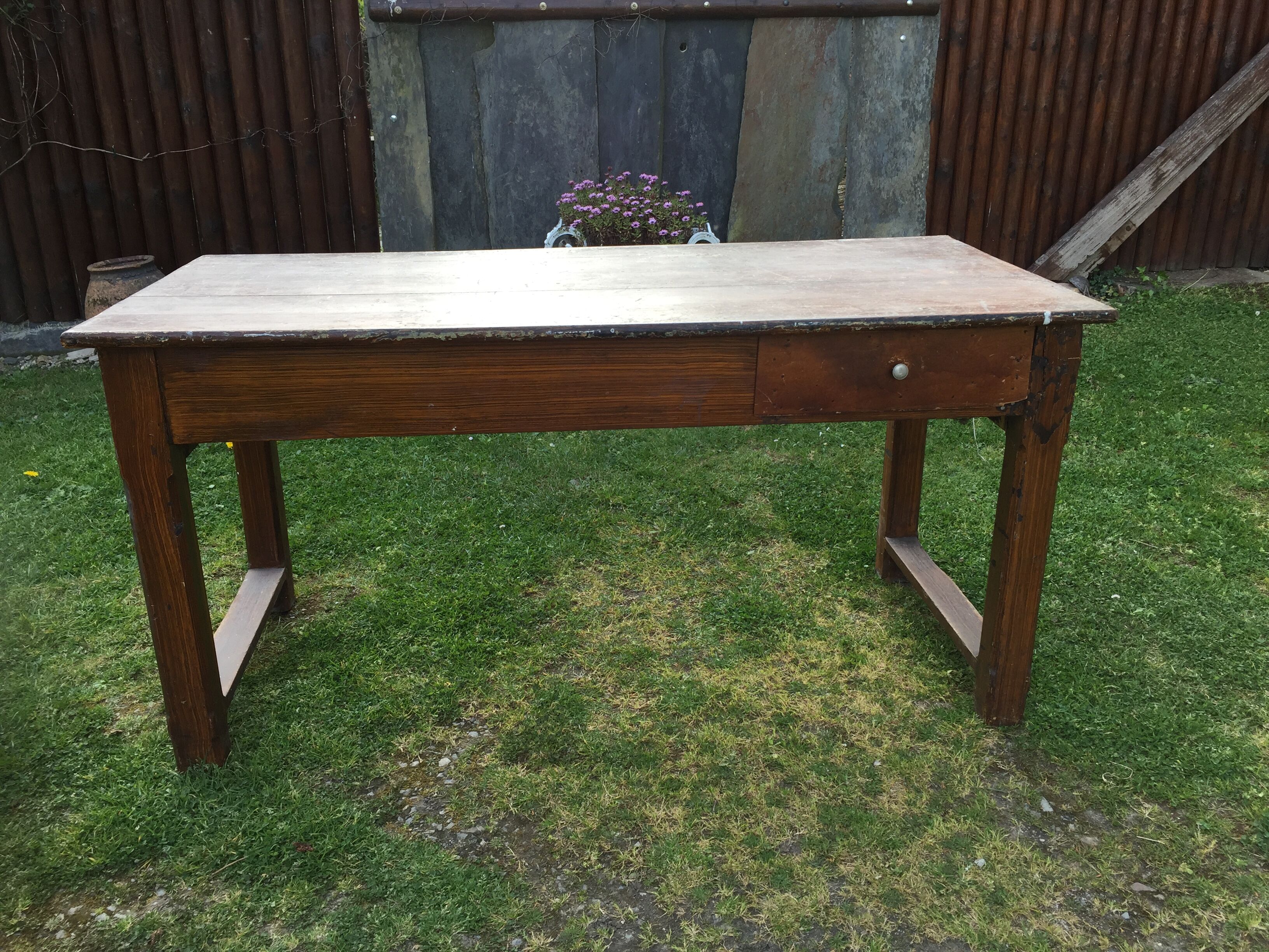 Old farmhouse table in oak painted faux wood old painting.