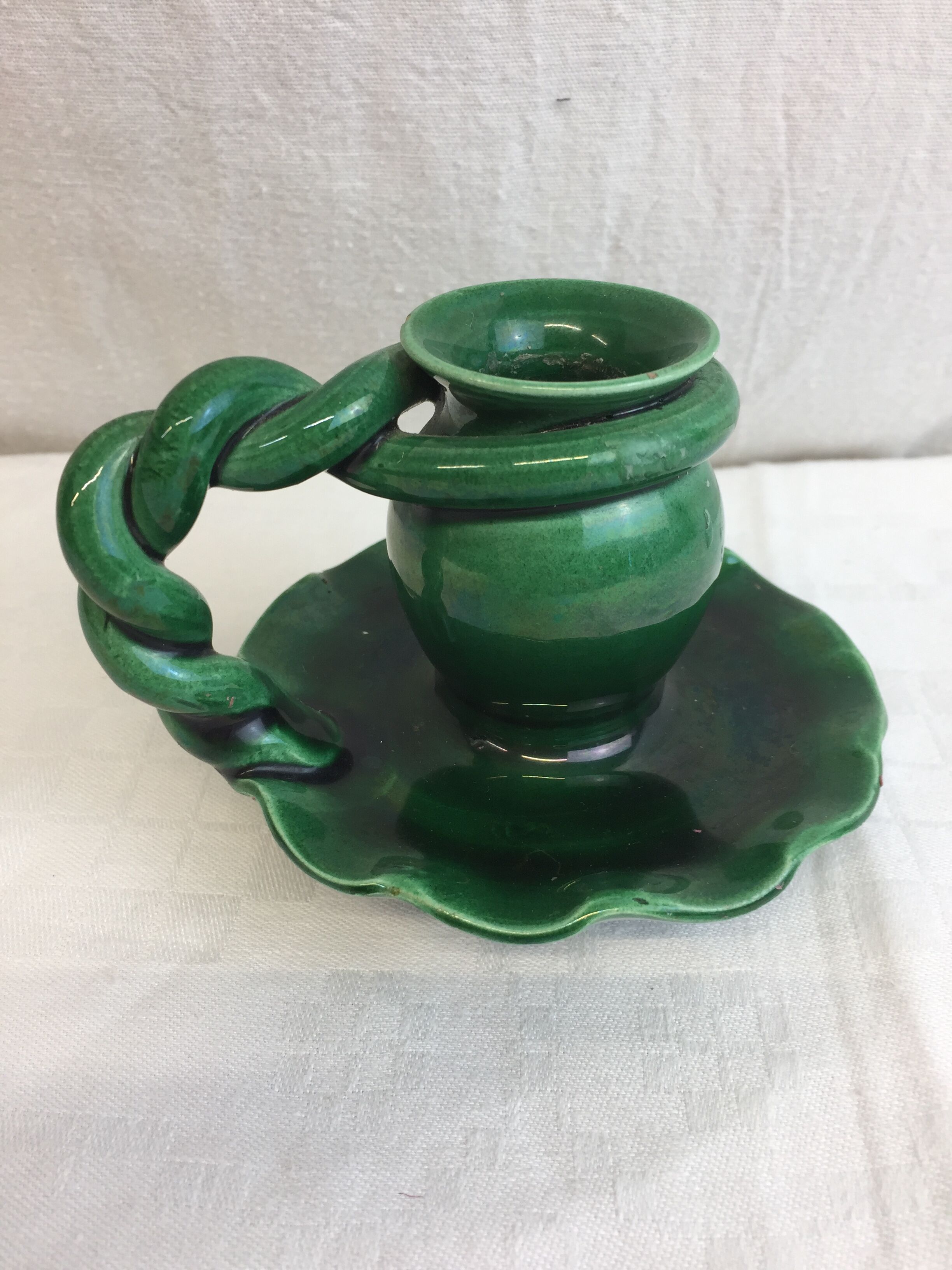 Old candleholder, glazed terracotta cellar, artisanal green color