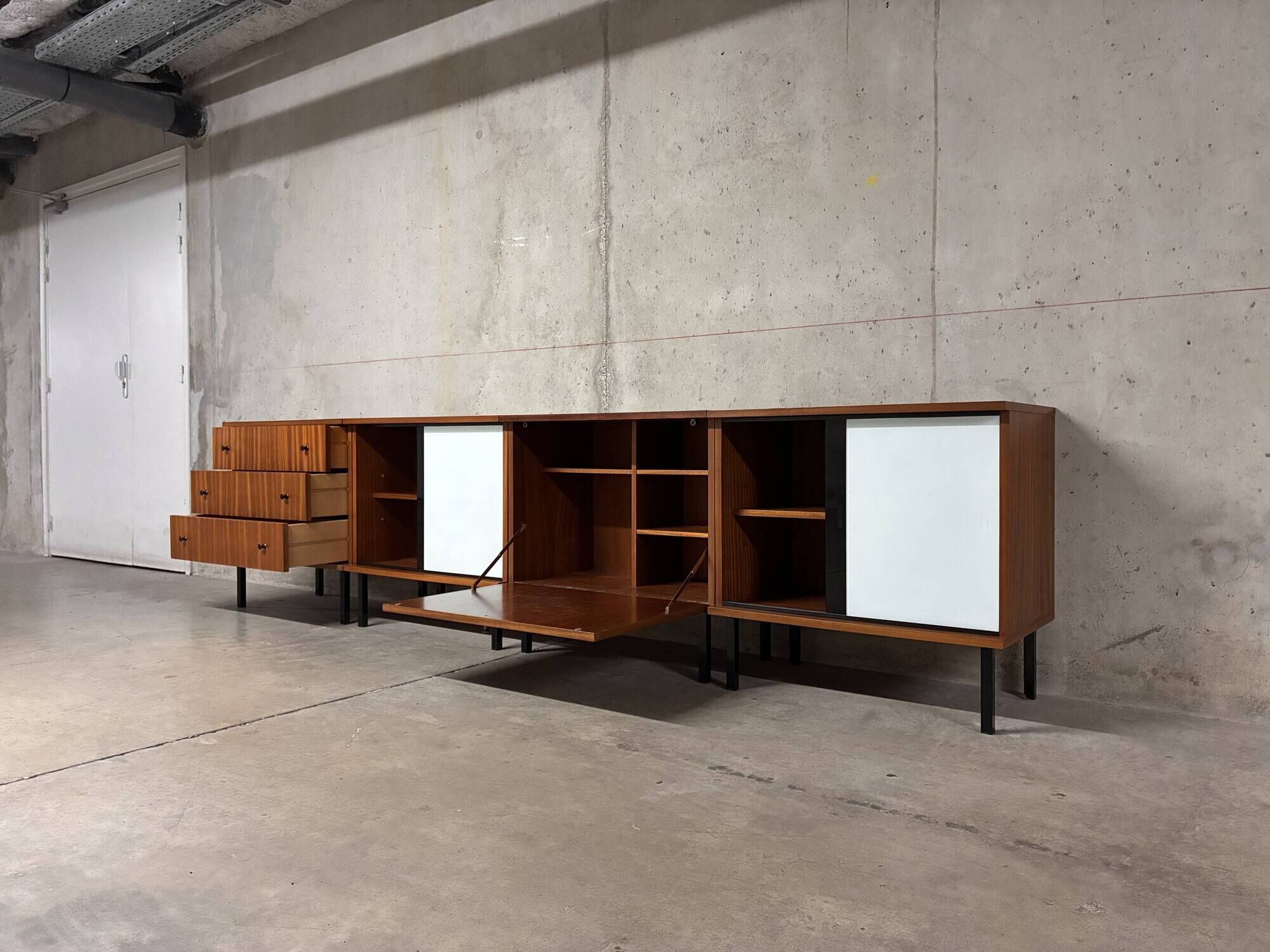 Enfilade buffet display cabinet in vintage 1950s style.