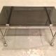 Table basse sur roulette 1970 chrome et verre fumé
