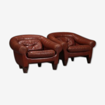 Pair of dark caramel leather armchairs