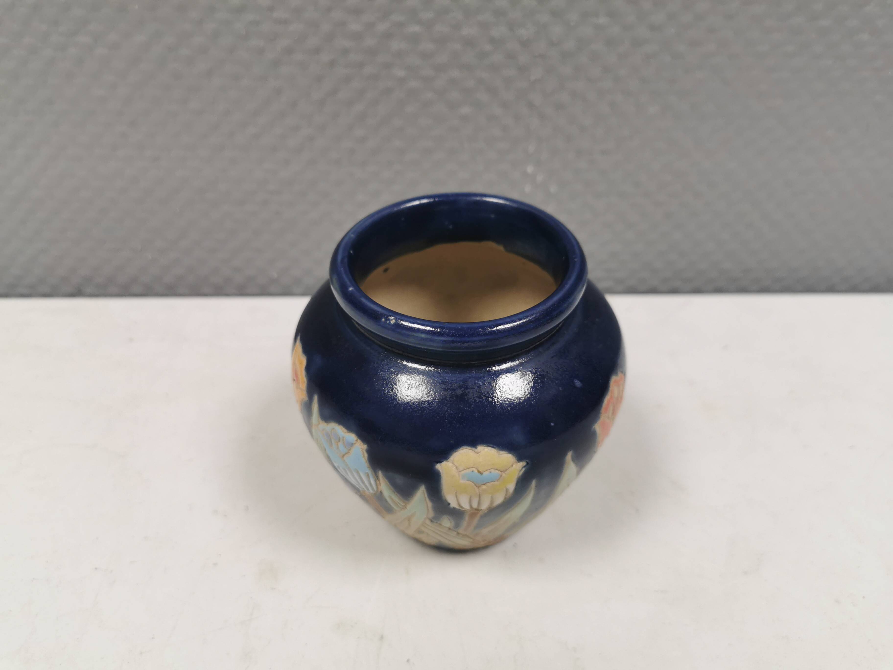 Small delicious blue ceramic vase with floral decoration. Sweden 1970s