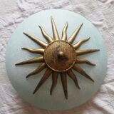 White opaque glass ceiling light and golden metal sun