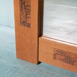 Vintage Danish wall mirror design from the 1960s in oak and stamped brass.