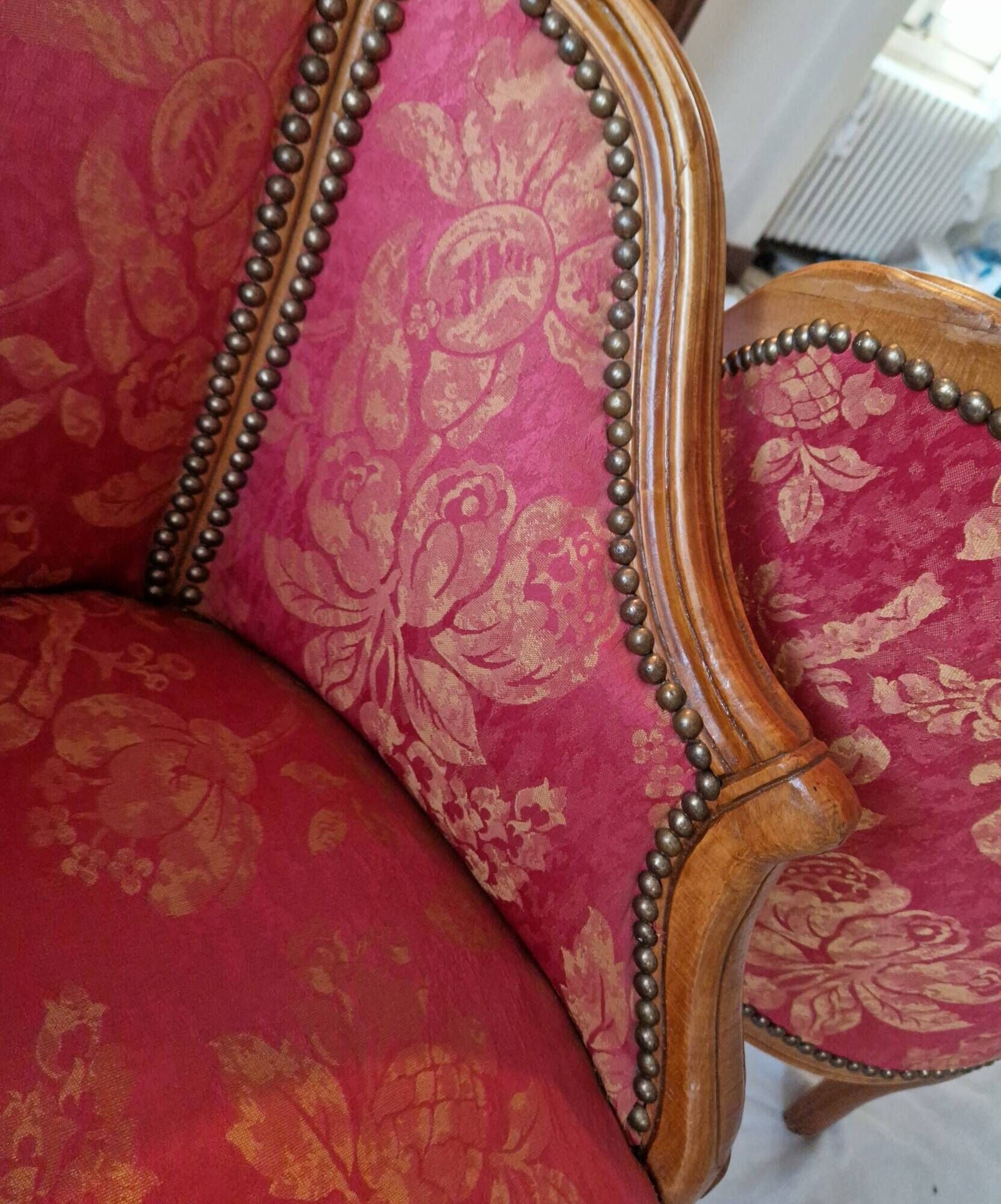 Pair of louis xv cabriolet armchairs with sculpted wood and pink & red floral fabric