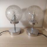 Duo of lamps in textured globe with a great play of light.