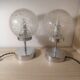 Duo of textured globe lamps with a large play of light.