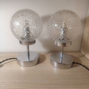 Duo of textured globe lamps with a large play of light.