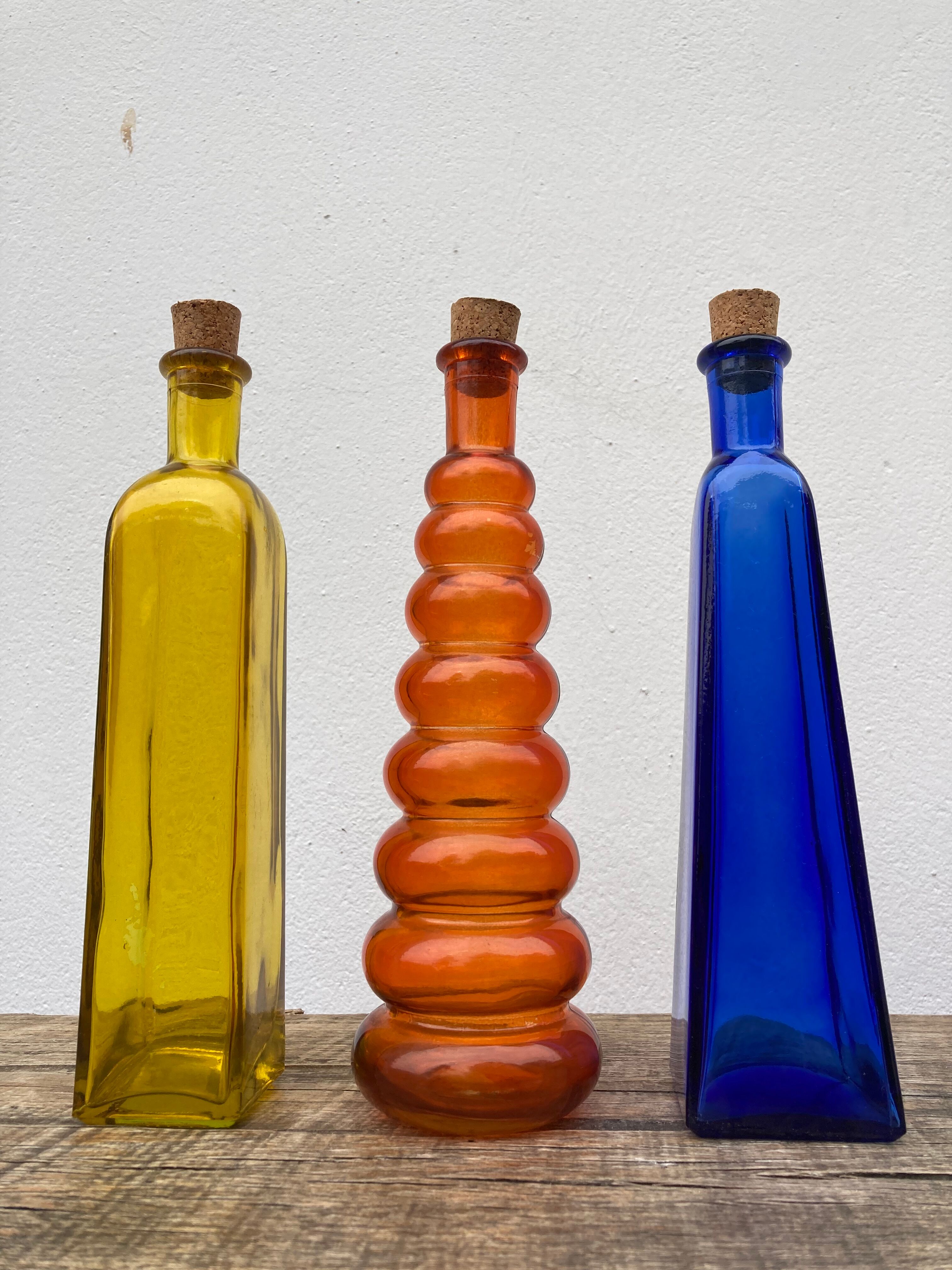 Trio of bottles 1970 color orange yellow and blue geometric shape
