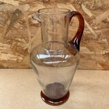 Antique clear blown glass pitcher + orange handle & foot vintage