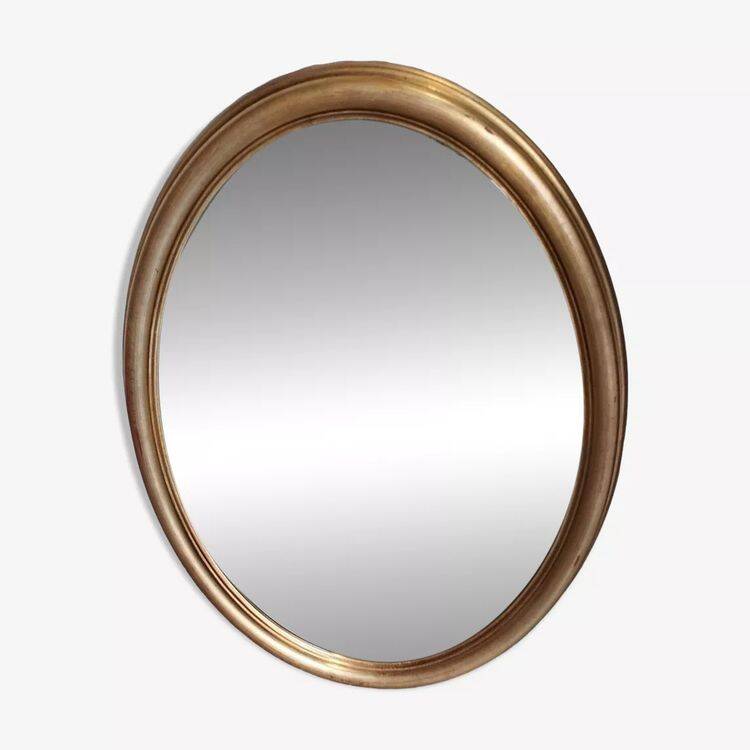 Grand et élégant miroir doré ovale avec sa glace biseauté